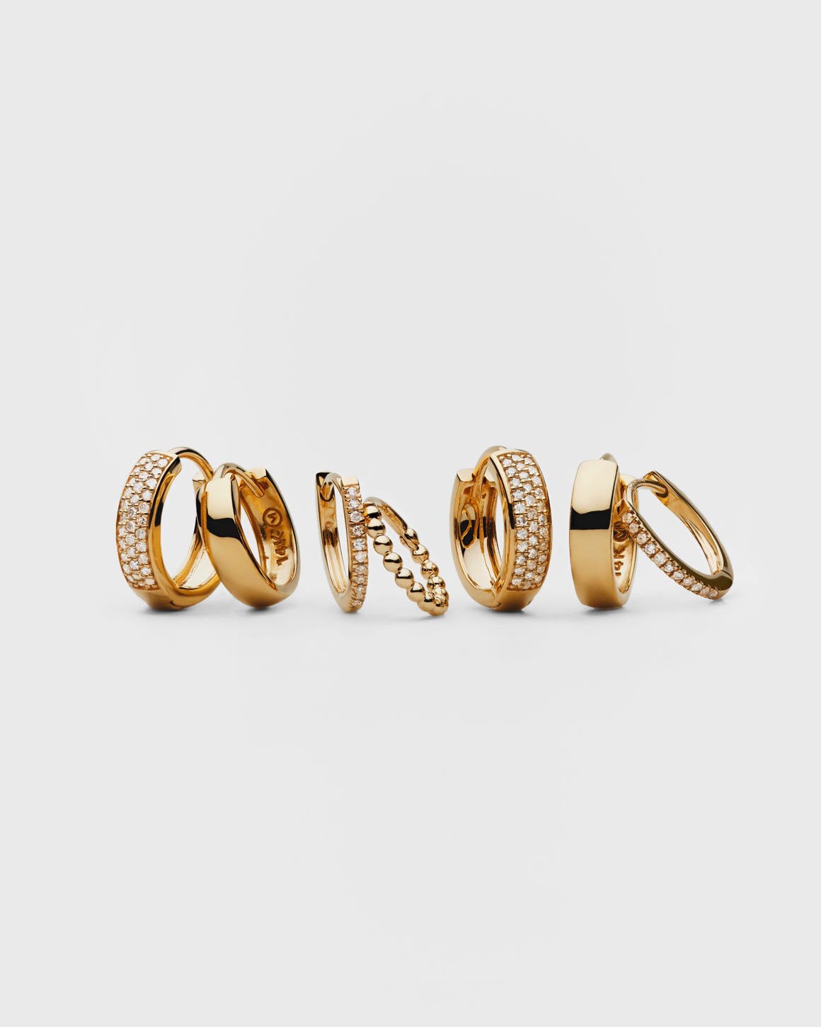 Gold and diamond earrings and rings.