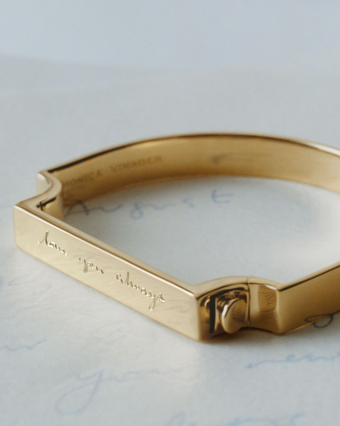 N125 exclusive; an engraved gold bracelet and pendant.