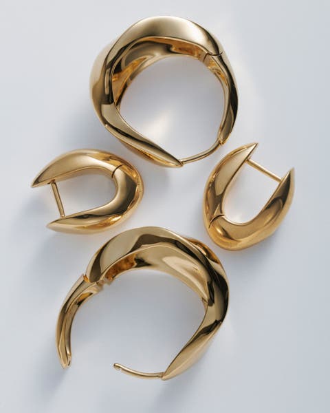 Assorted gold Monica Vinader earrings.