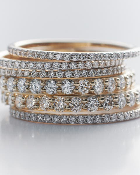 Diamond Monica Vinader bangles stacked on top of each other.
