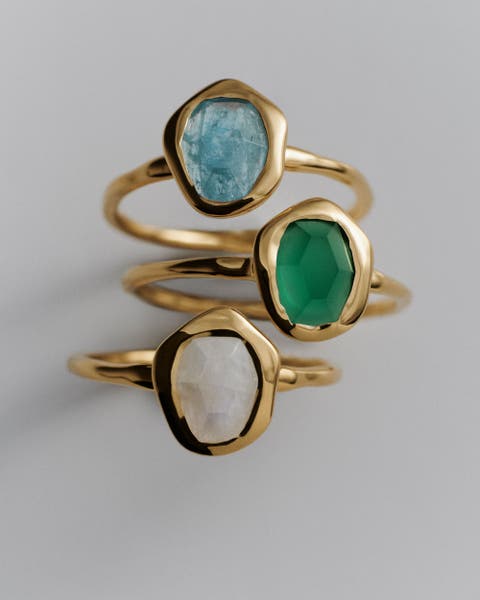 Gold Monica Vinader Rings with gems.