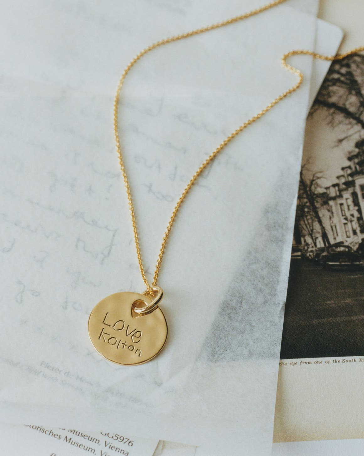 A gold necklace with custom engraving.