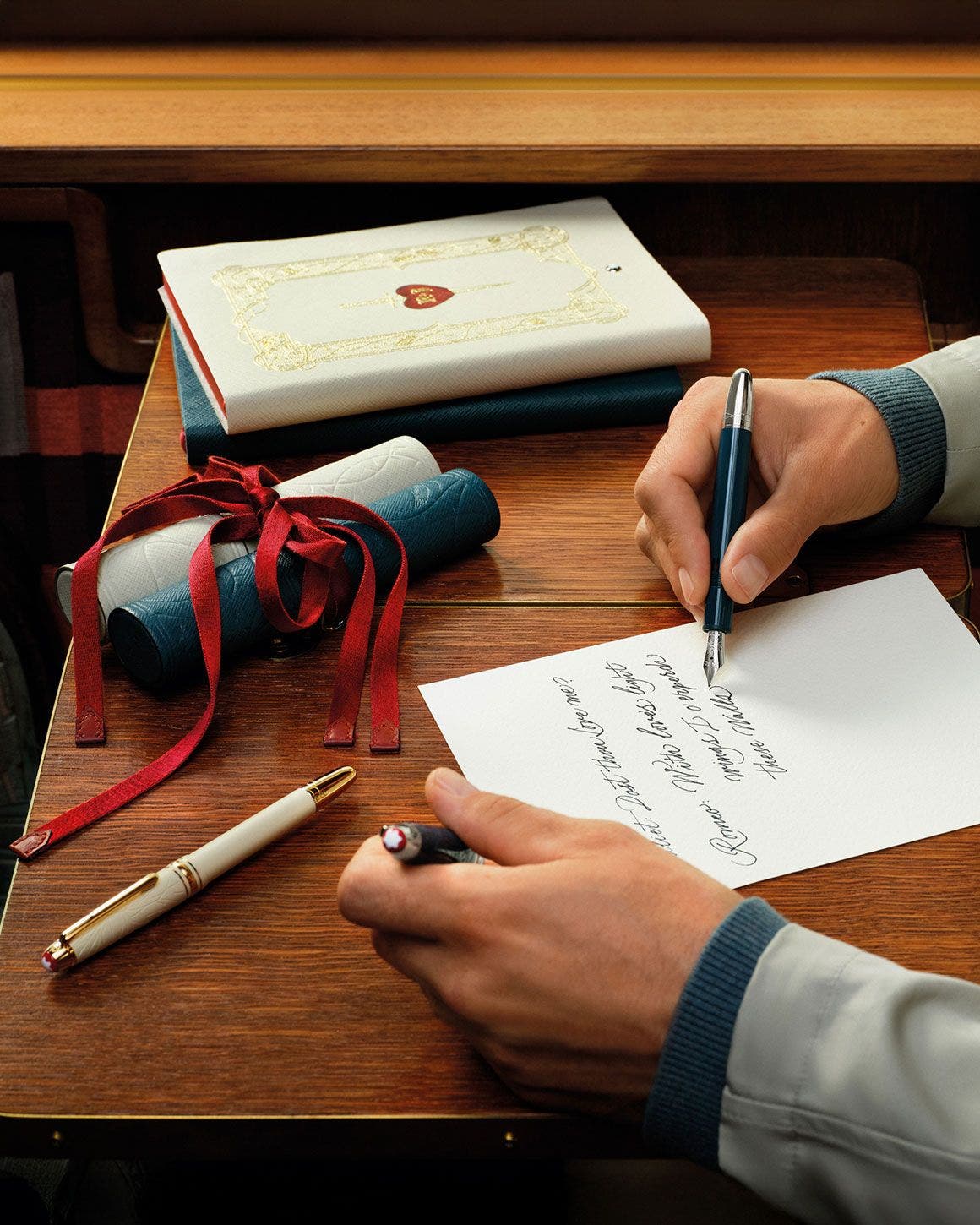 Man writing a letter with Montblanc fountain pen.