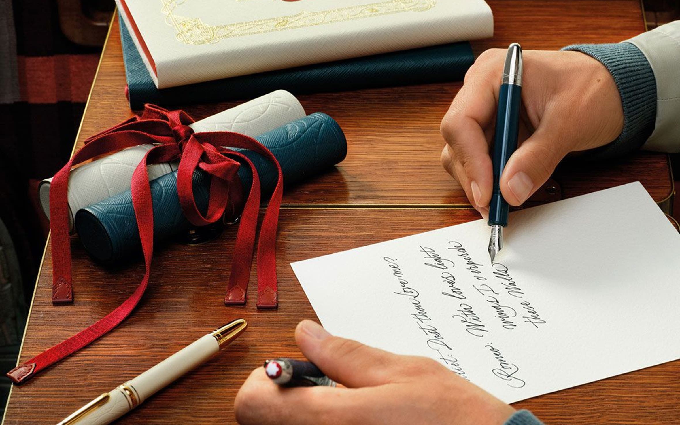Man writing a letter with Montblanc fountain pen.
