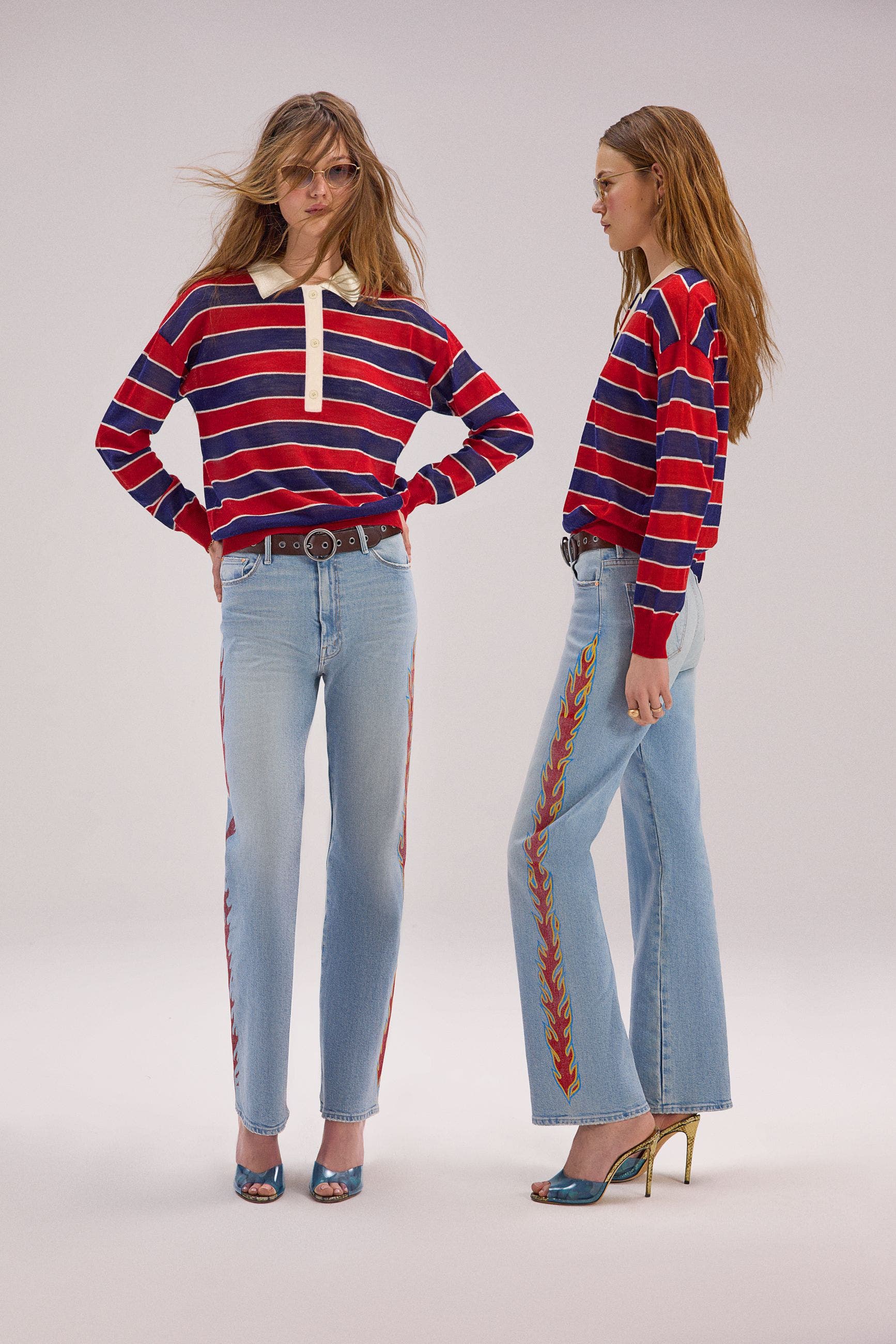 A woman wearing a long sleeve, striped polo shirt.
