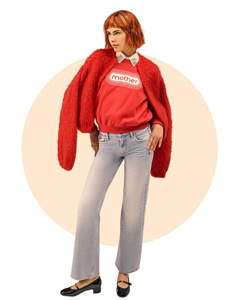 Woman wearing red jacket over a red crewneck with "MOTHER" printed on it with white letters