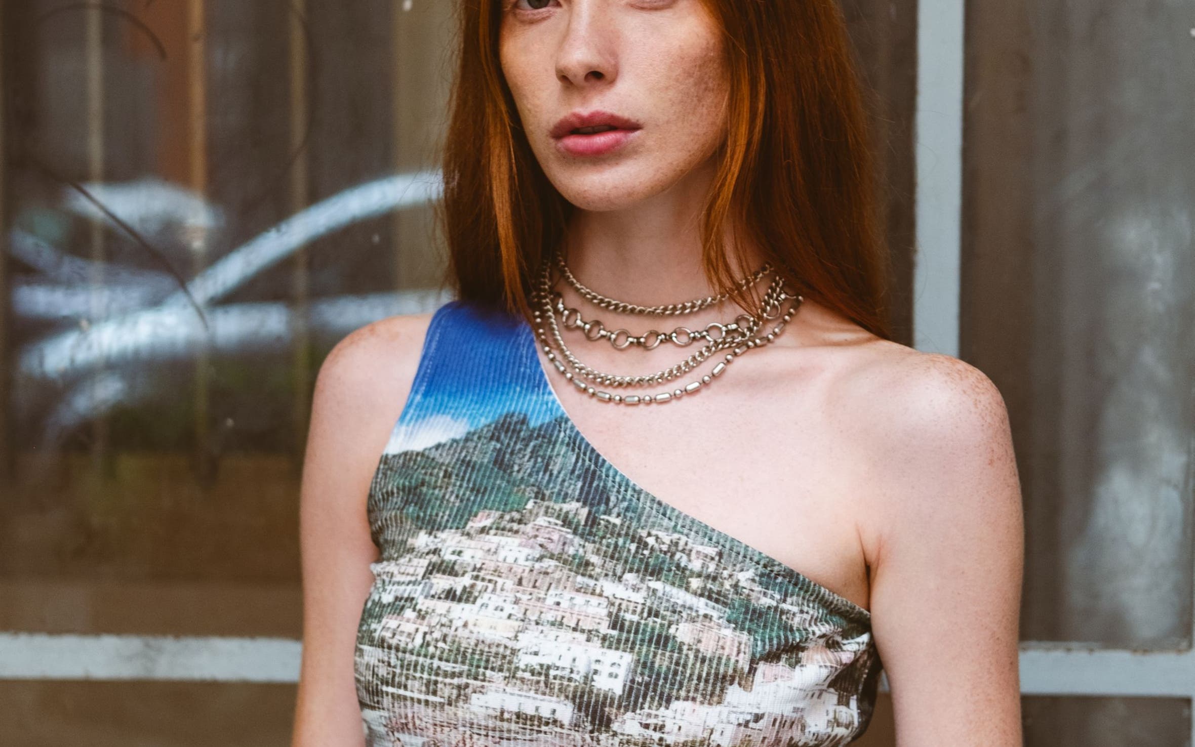 A woman wearing a screen printed tank top.
