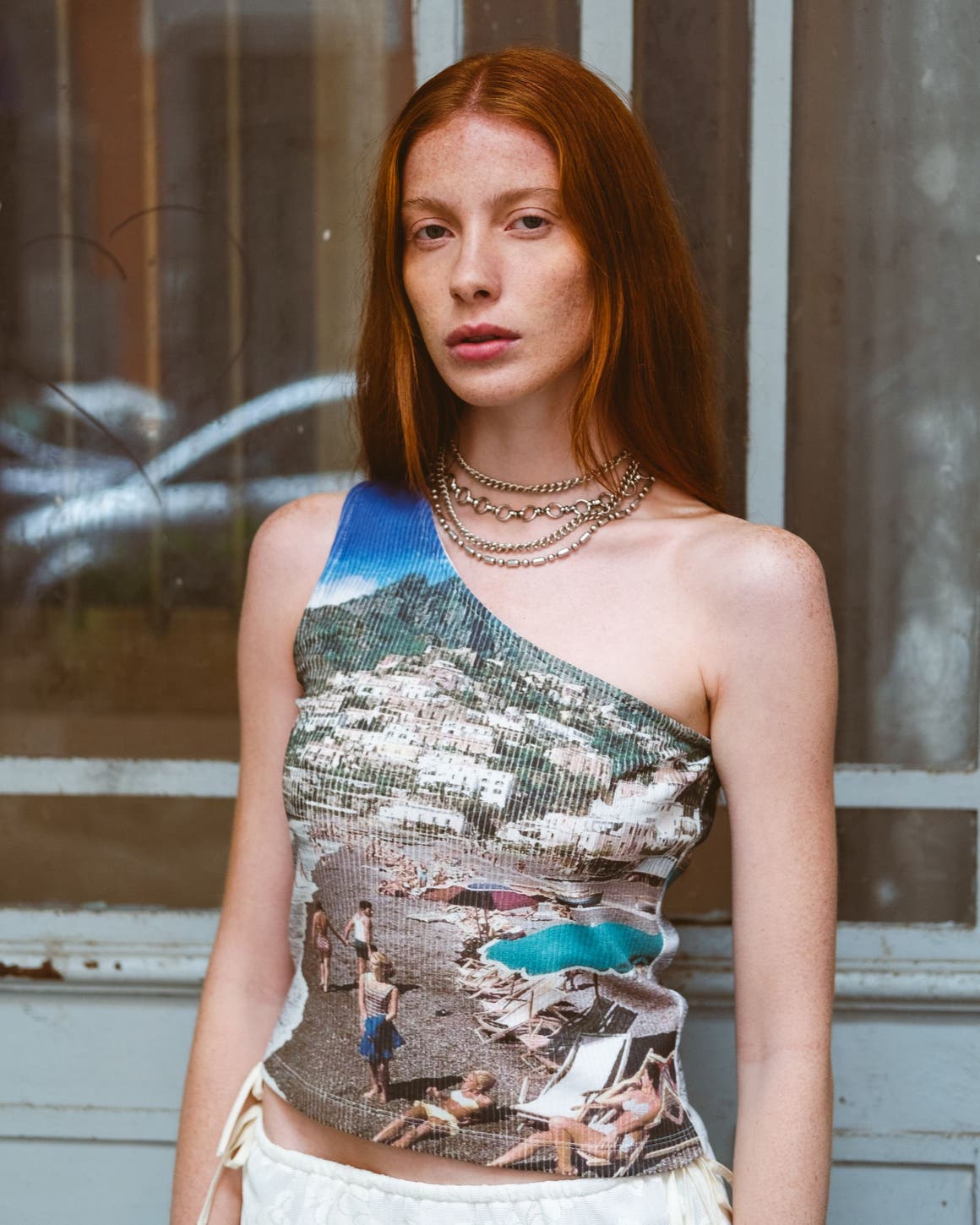 A woman wearing a screen printed tank top.