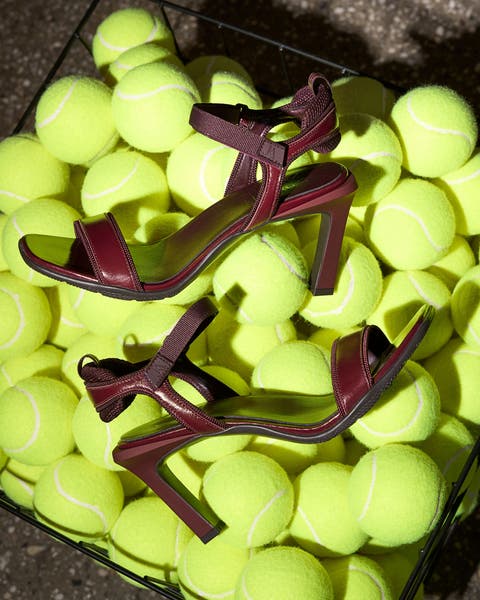 Maroon heels on bed of tennis balls