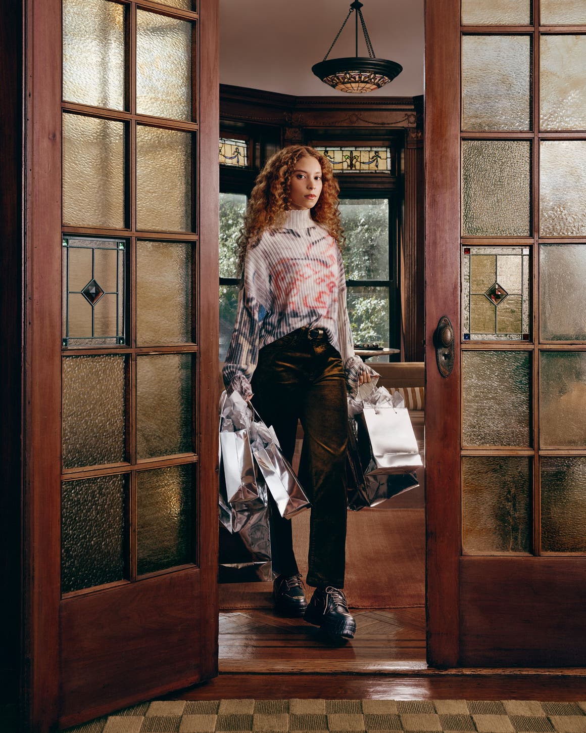 A woman wearing Nike and Jordan apparel and shoes.