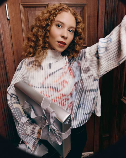 A woman wearing Nike and Jordan apparel.