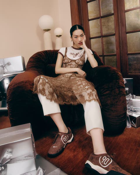 Woman wearing Nike and Jordan sneakers and apparel.