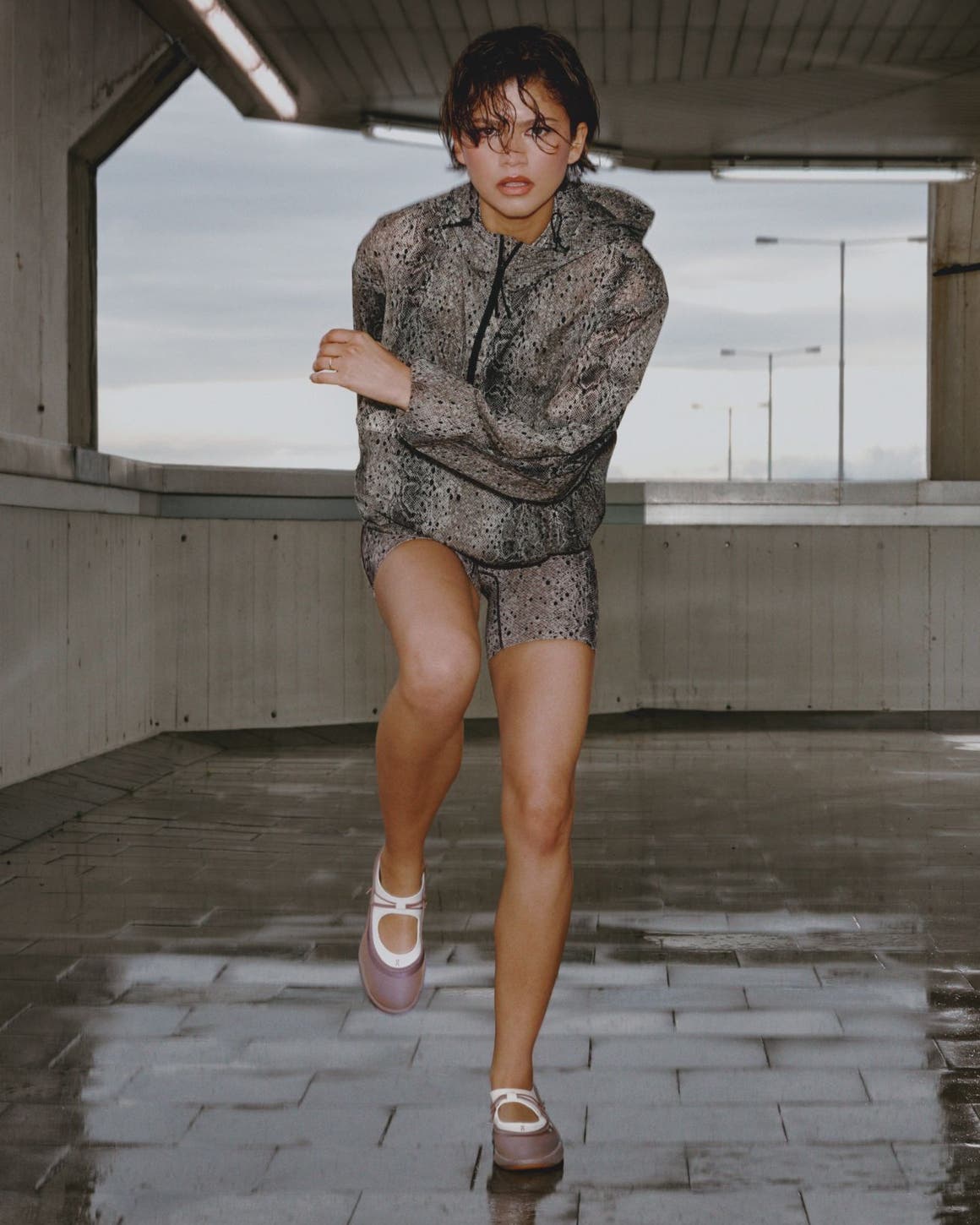 Zendaya wearing a snakeskin printed workout set and On mary janes.