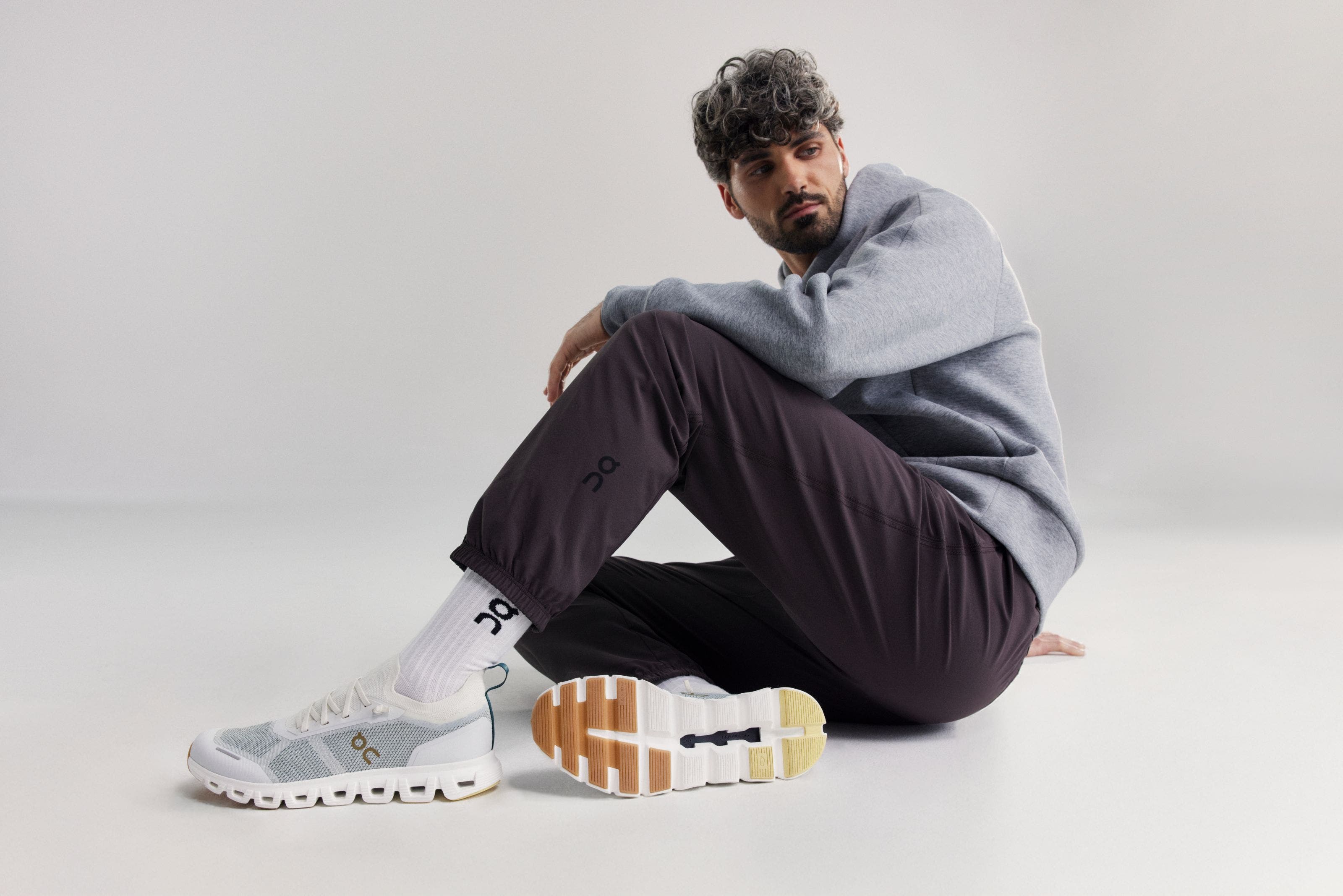 Man wearing On socks and running shoes.