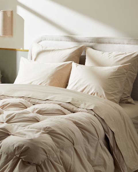 A bed with a Parachute bedding set.