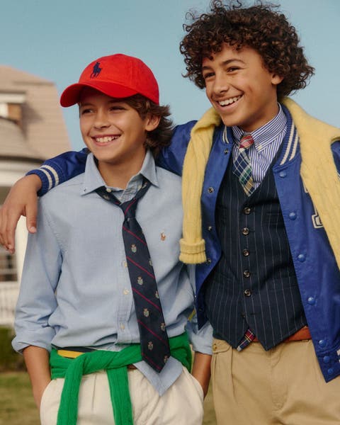 Two models wearing Polo Ralph Lauren Kids look
