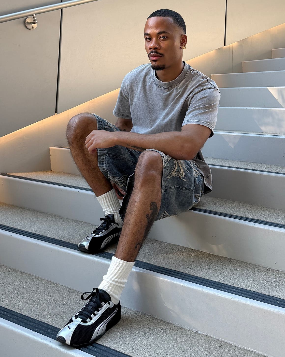 Man wearing PUMA sneakers.