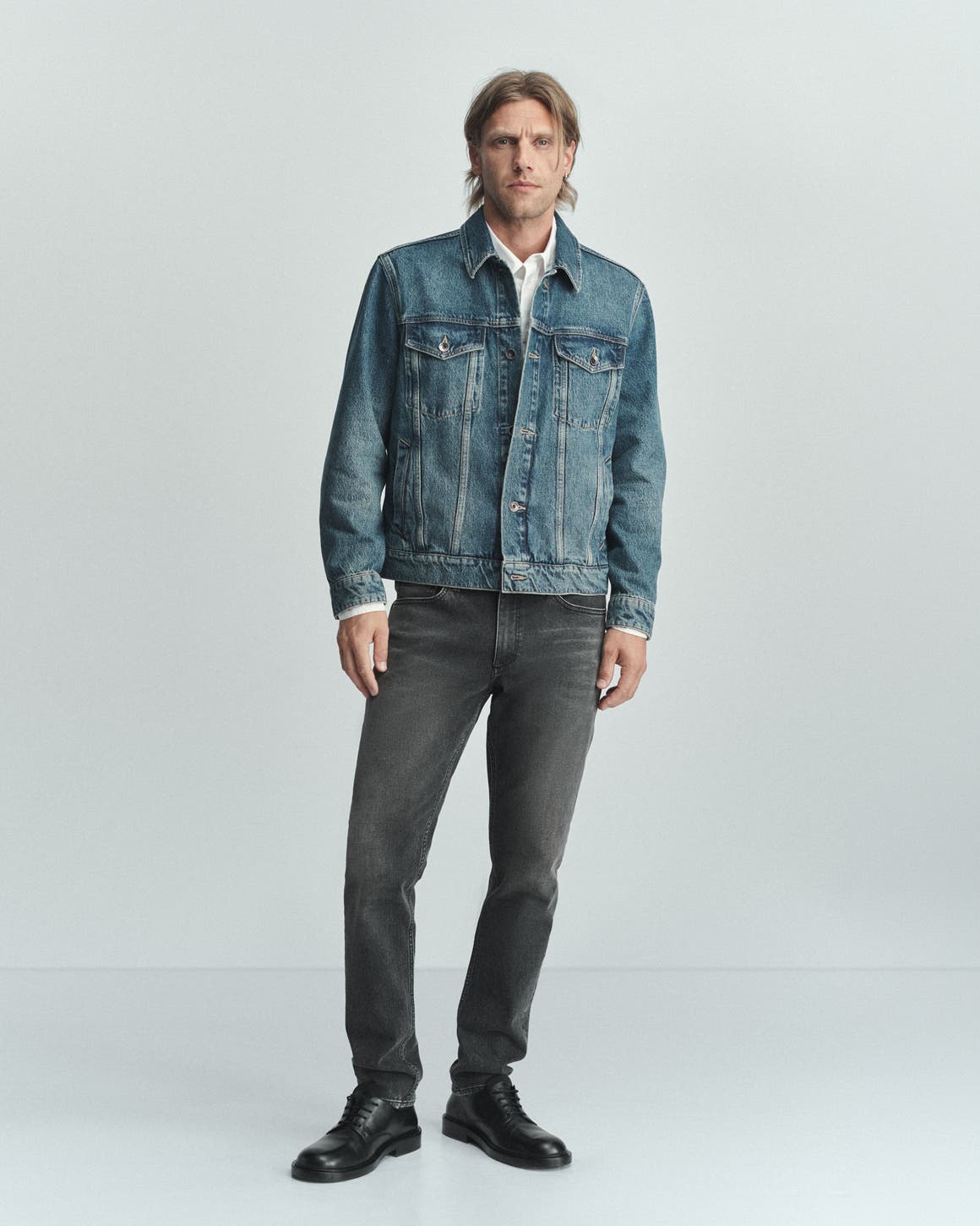 A man wearing rag & bone denim jacket and jeans.