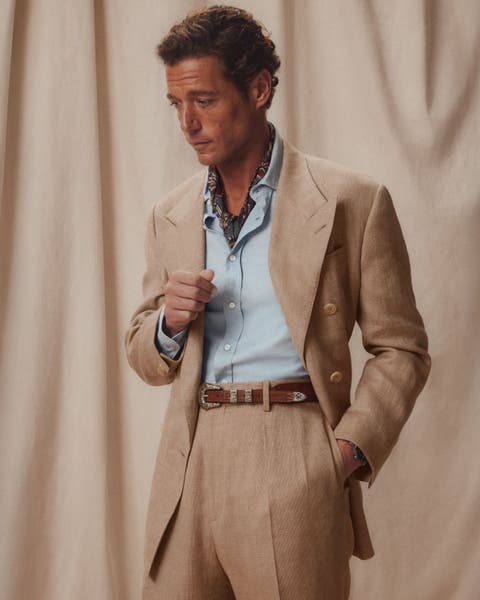 Man wearing Ralph Lauren Purple Label tan suit.