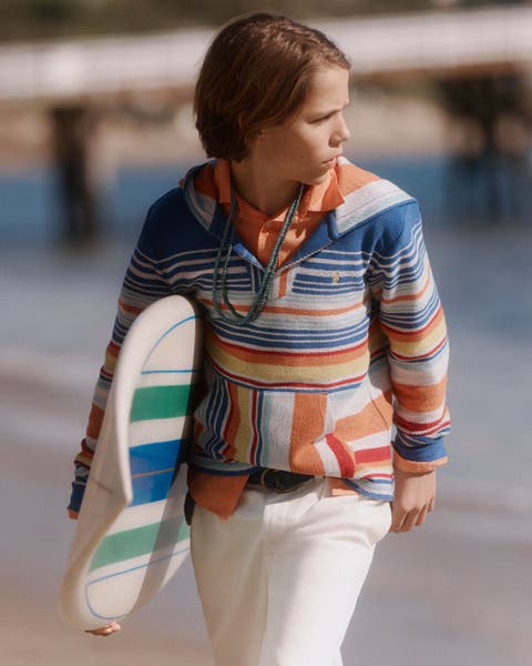 Boy wearing Polo Ralph Lauren Kids at the beach.