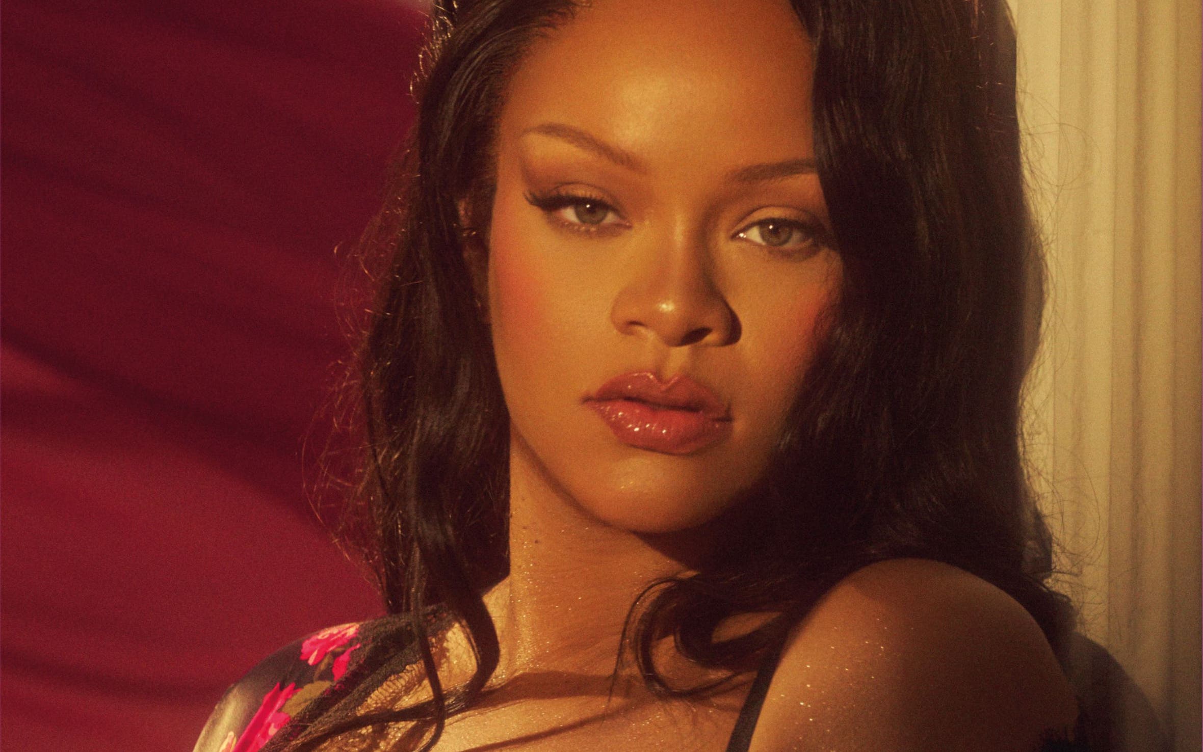 Rihanna wearing a SAVAGE X FENTY floral-print bra and top.