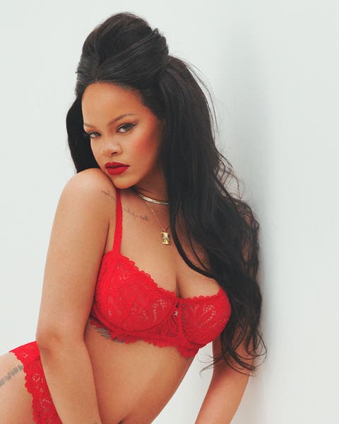 Rhianna in a red lacey underwire bra.