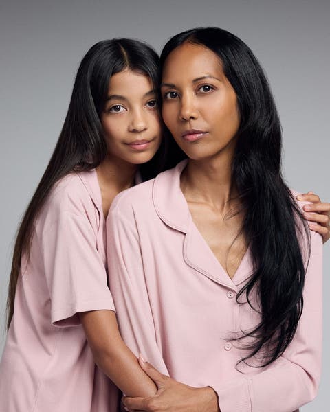 Mom and daughter wearing Skims pajamas. 