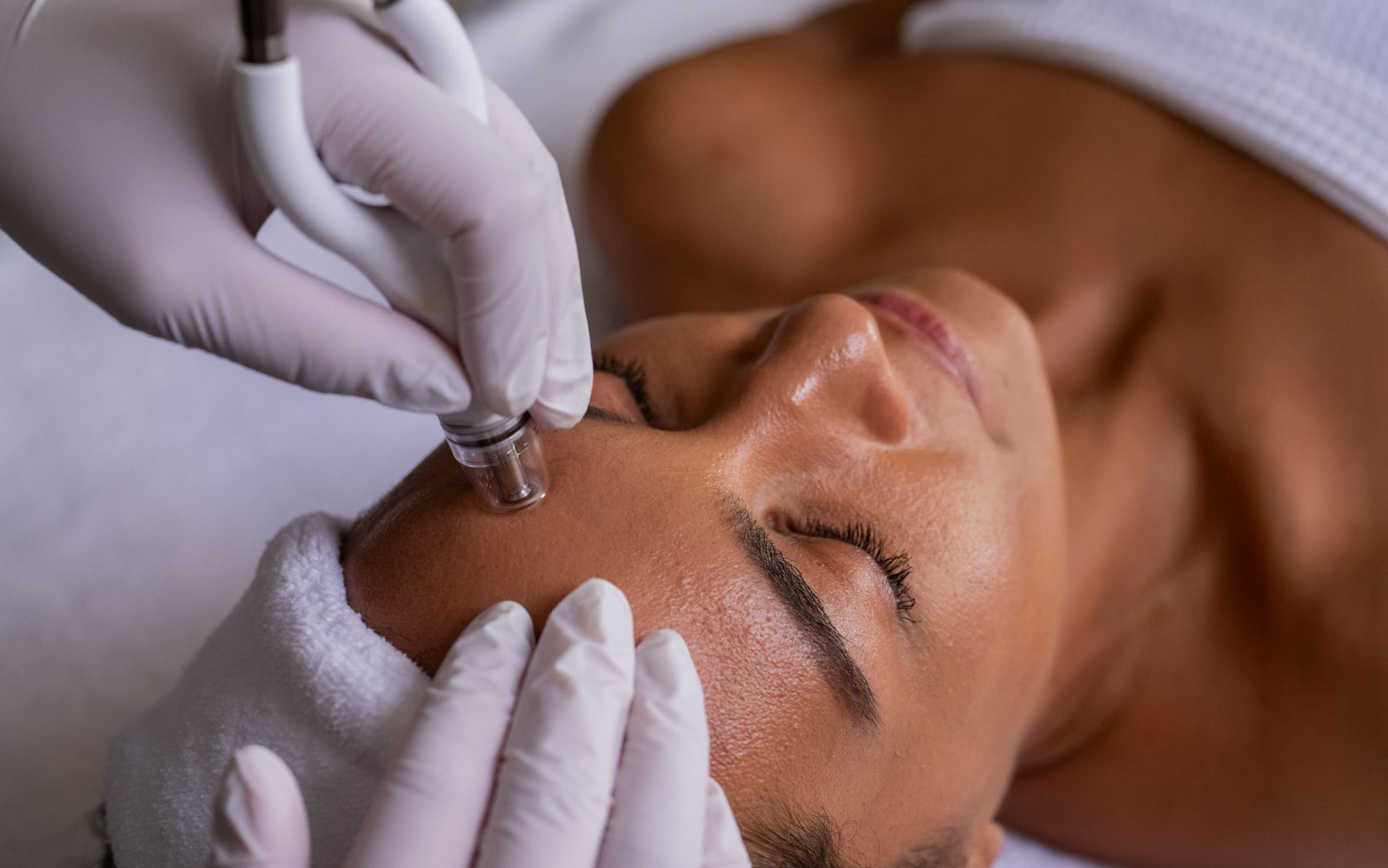 A woman getting a facial.