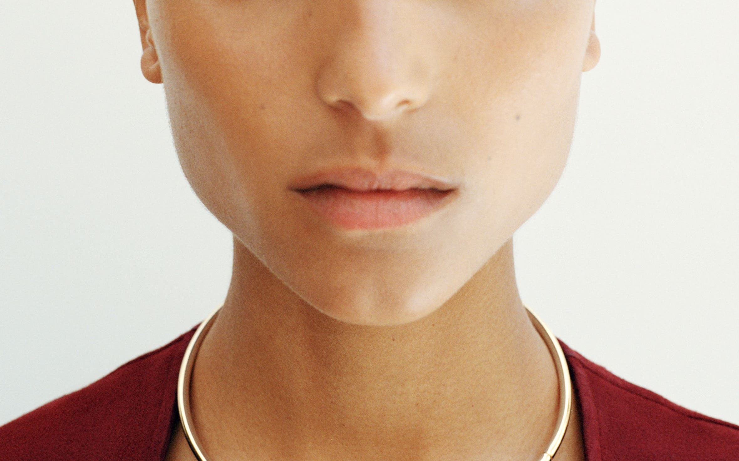 A woman wearing a necklace.