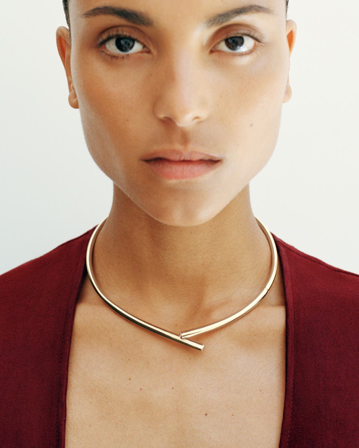 A woman wearing a necklace.