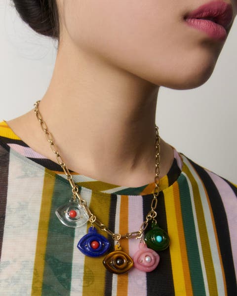 A woman wearing a colorful necklace.