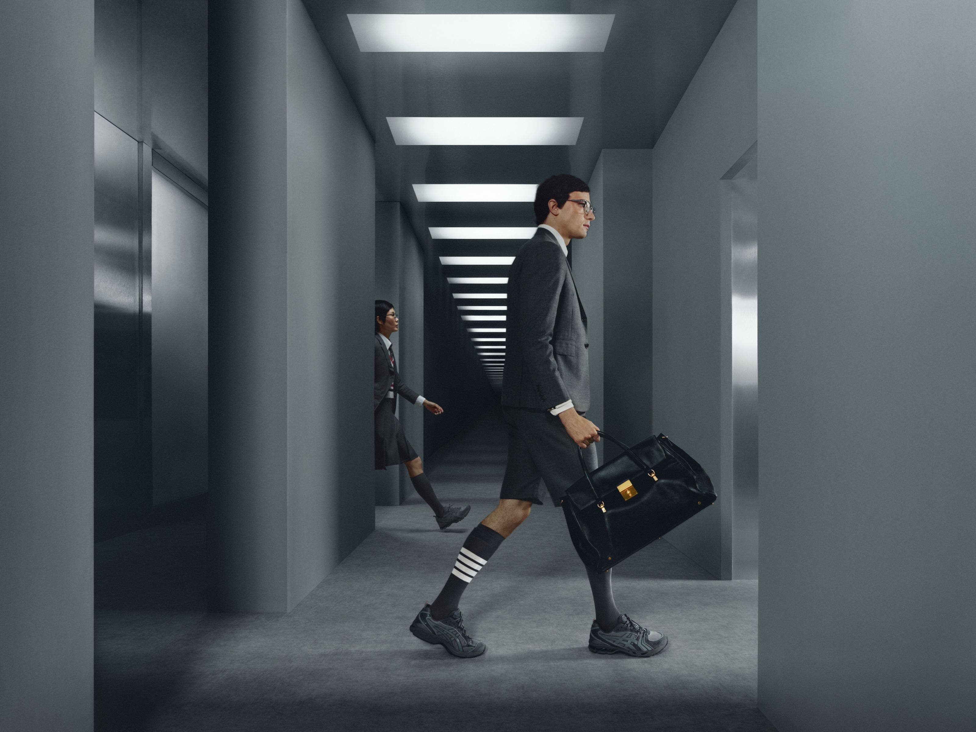 Models wearing Thom Browne x ASICS sneakers.