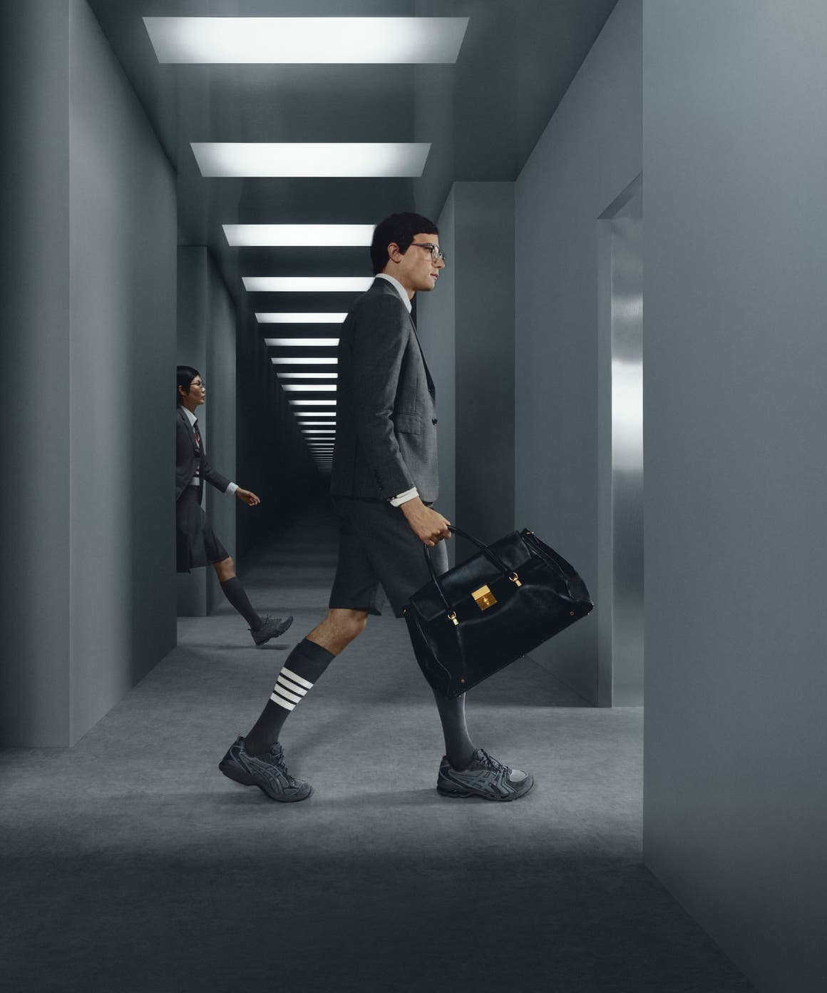 Models wearing Thom Browne x ASICS sneakers.