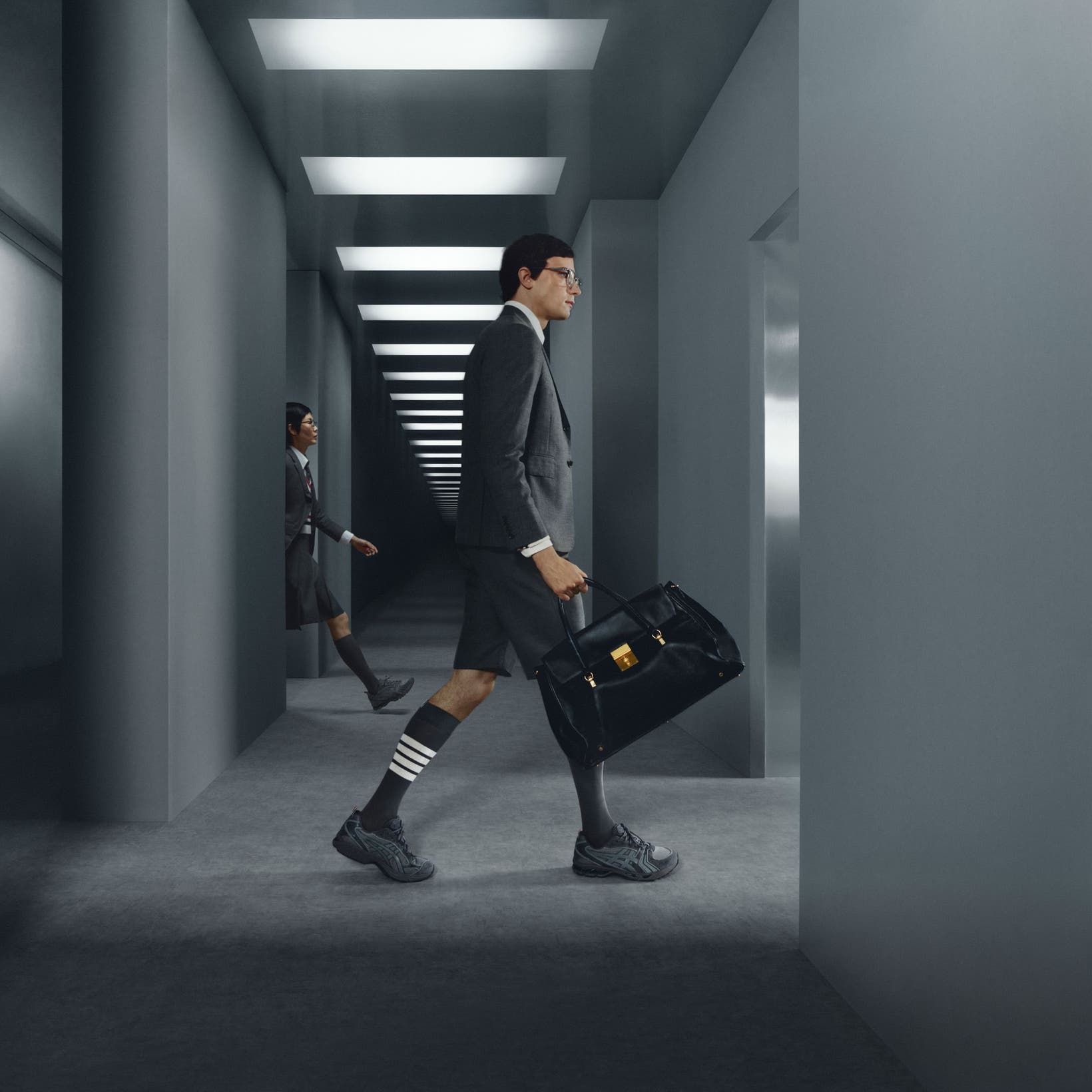 Models wearing Thom Browne x ASICS sneakers.