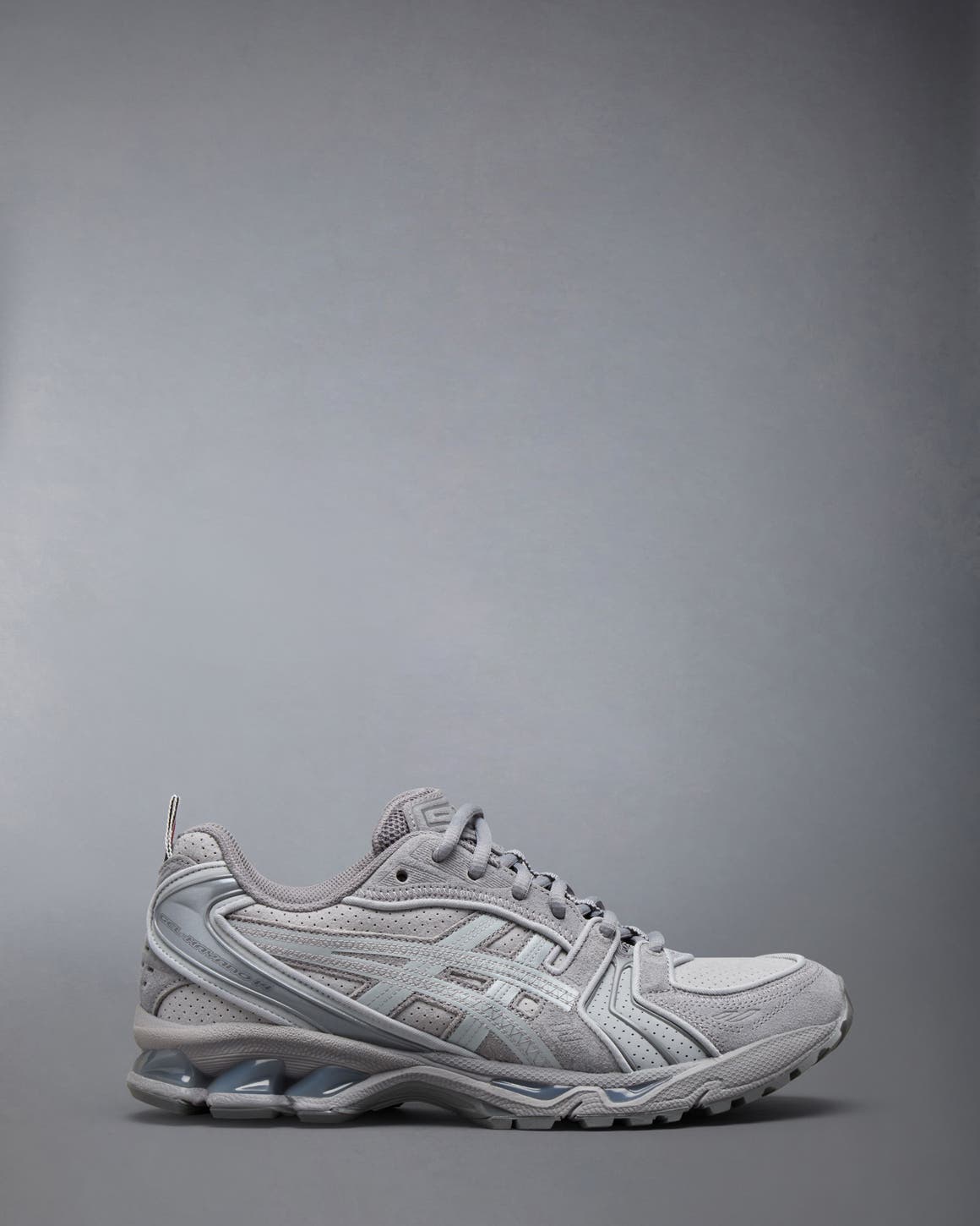 Thom Browne x ASICS sneaker in grey.
