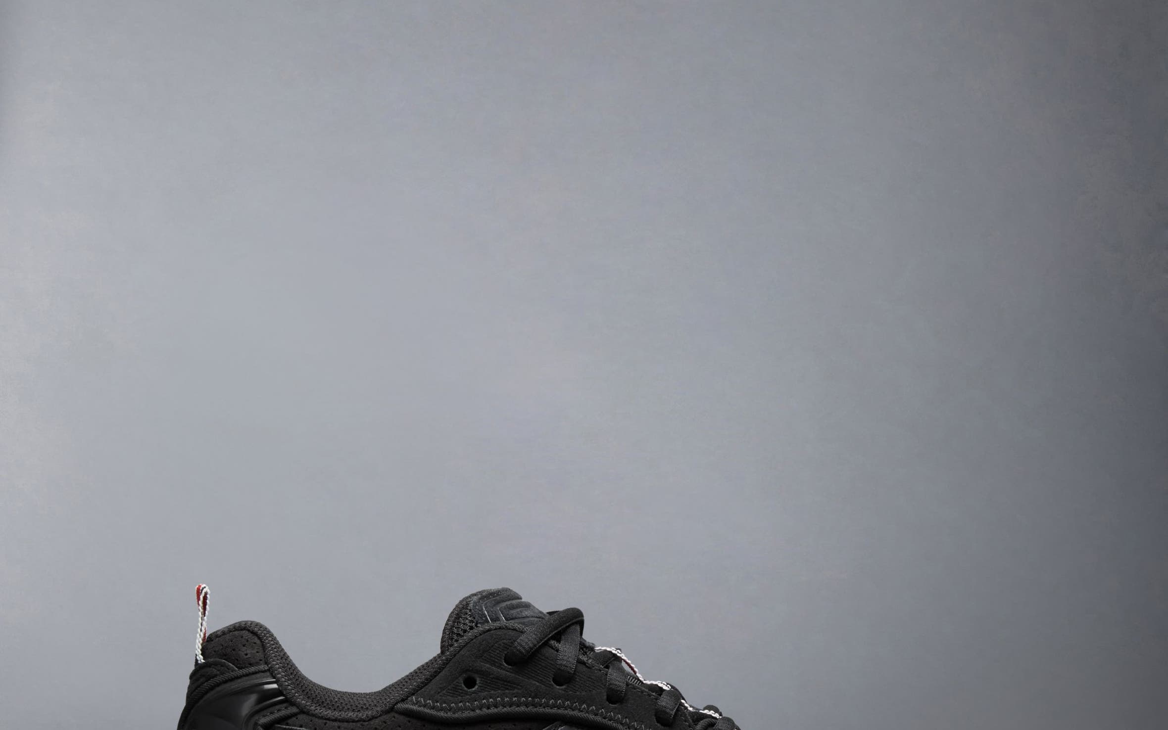 Thom Browne x ASICS sneaker in black.