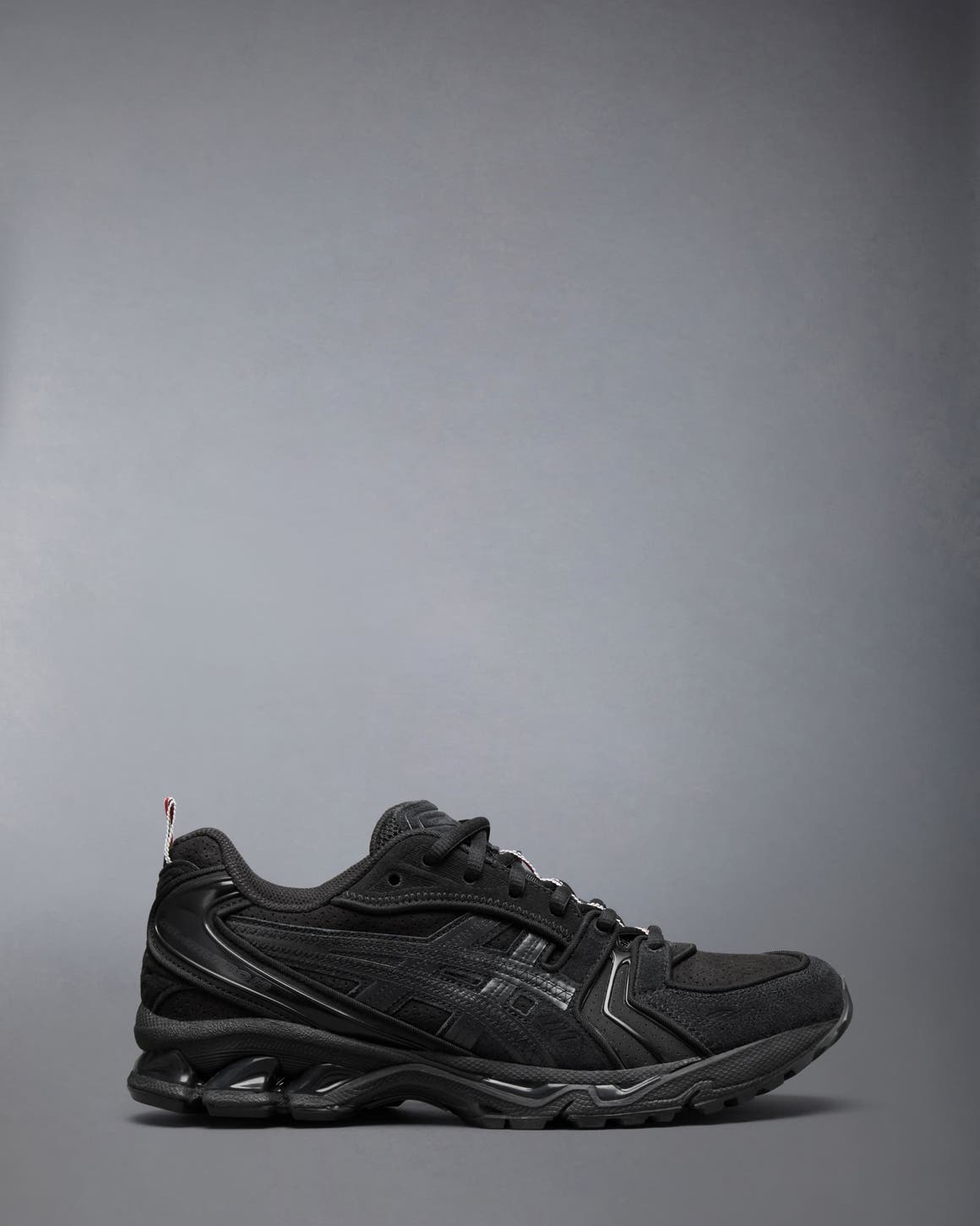Thom Browne x ASICS sneaker in black.