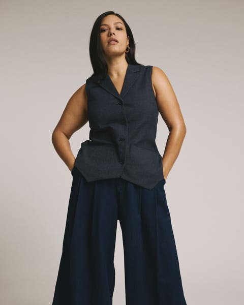 Woman in a plus-size vest and matching pants.