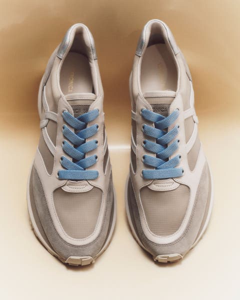 Neutral Veronica Beard Sneakers with blue laces.