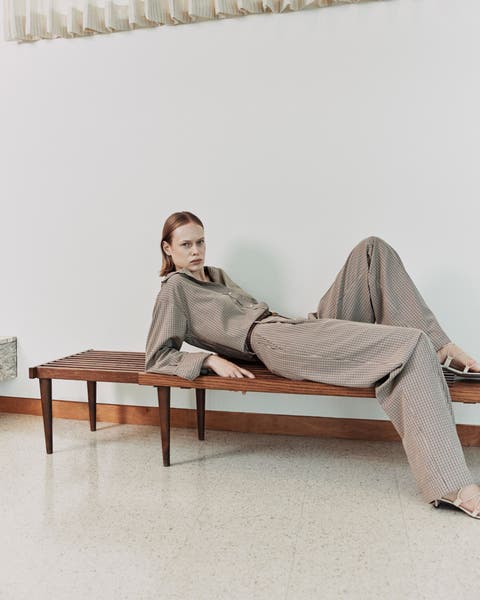 Woman wearing taupe Vince look.