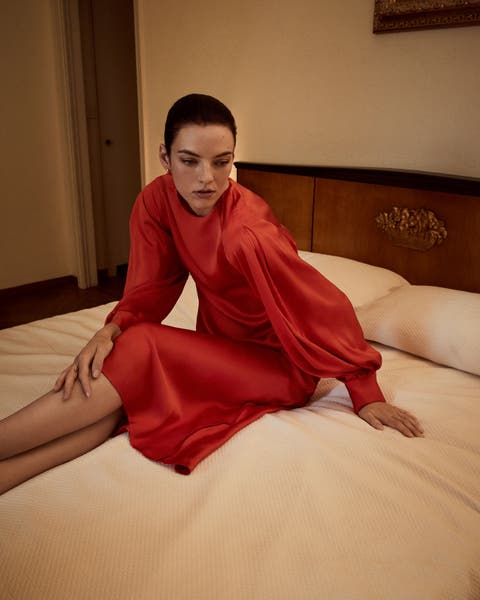 Woman wearing red Vince look.