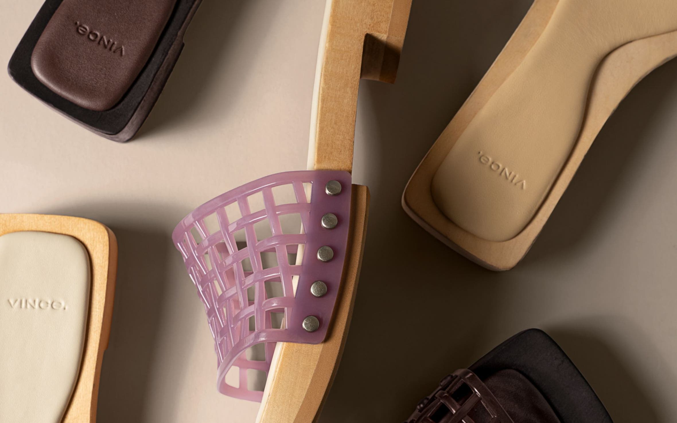 Slide sandals with open-weave jelly straps.