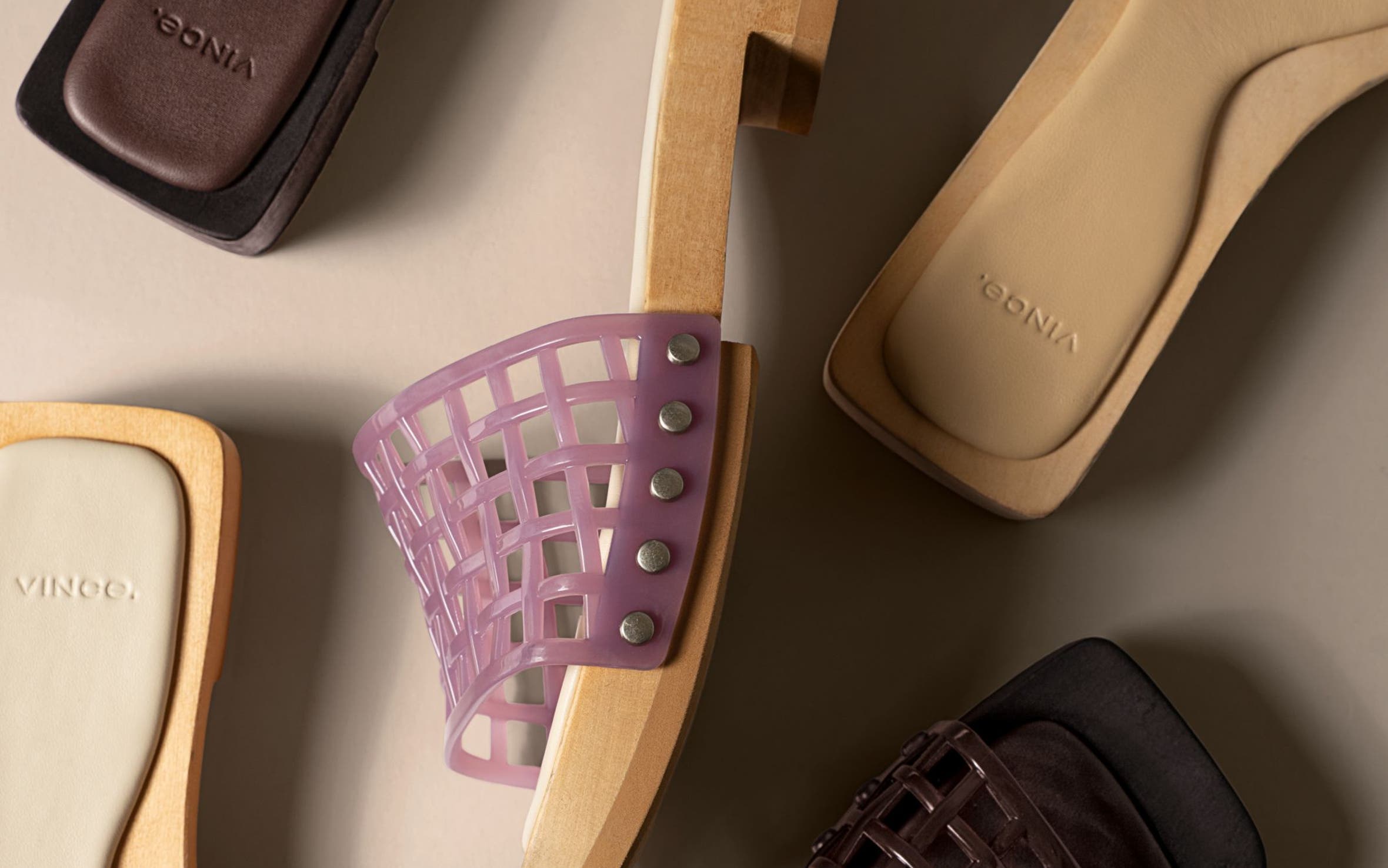 Slide sandals with open-weave jelly straps.