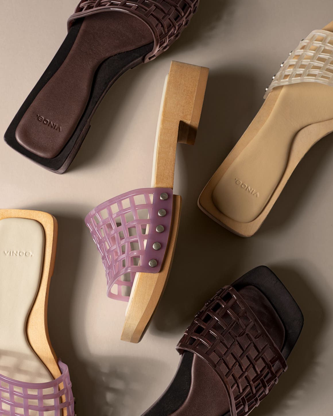 Slide sandals with open-weave jelly straps.