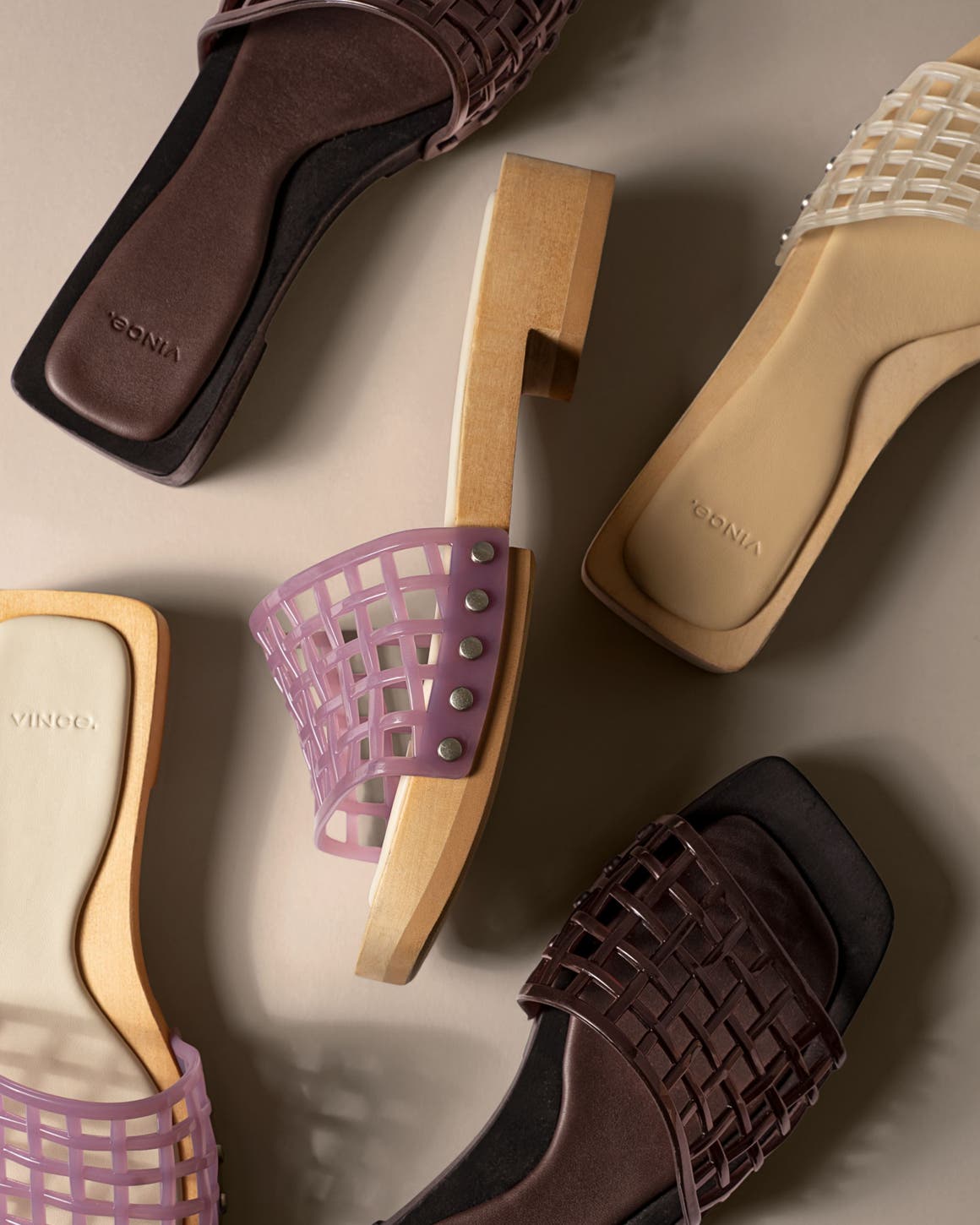 Slide sandals with open-weave jelly straps.