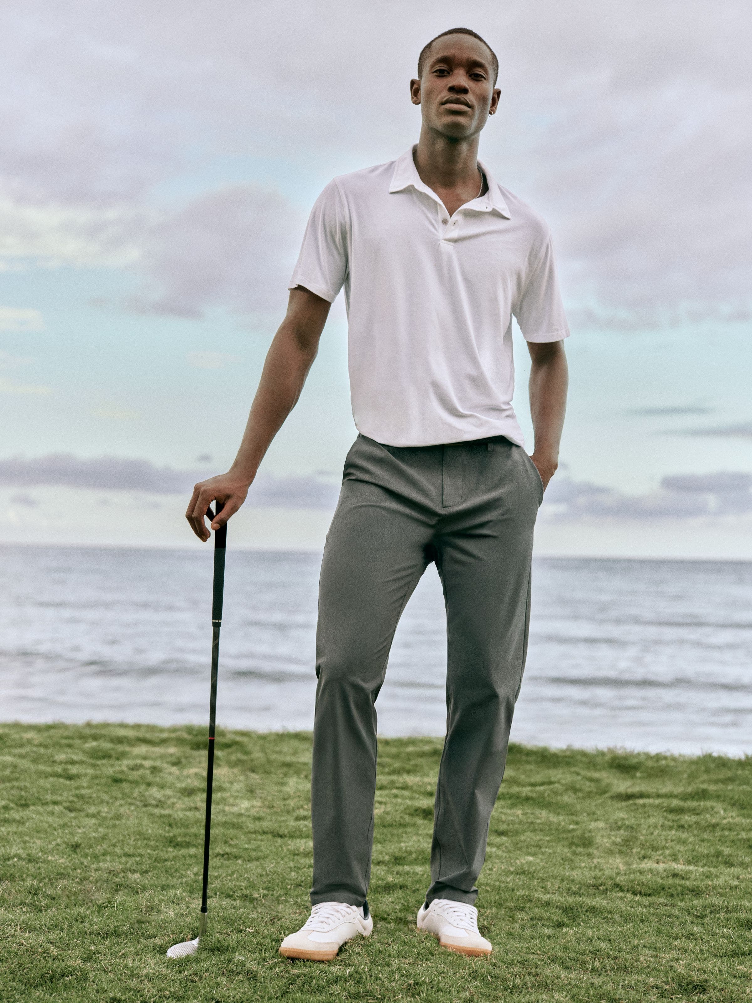 A man wearing a polo shirt and pants.