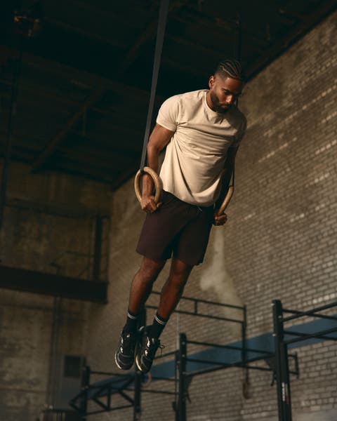 Man wearing white Vuori T-shirt and shorts.