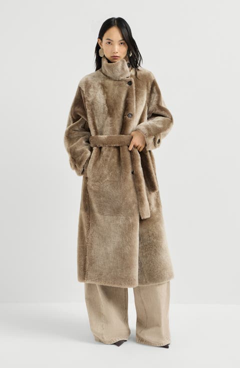 Shearling coat with belt and monili