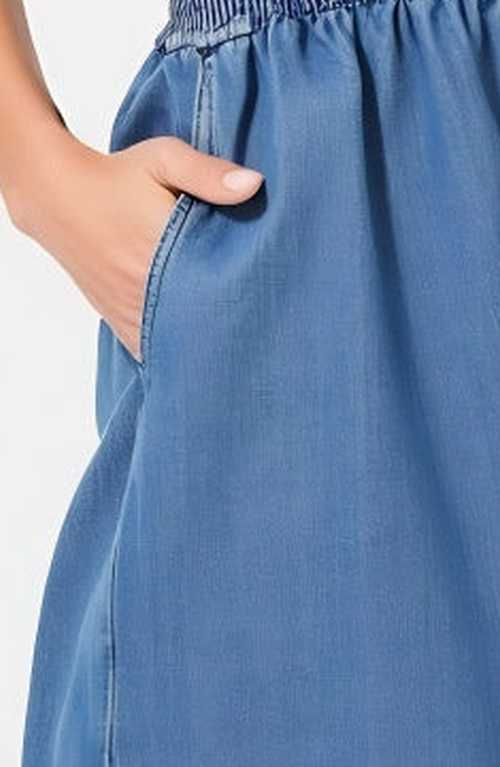 Modenaire Denim Romper With Cap Sleeves Smocked Waist And Front Zip Closure In Blue