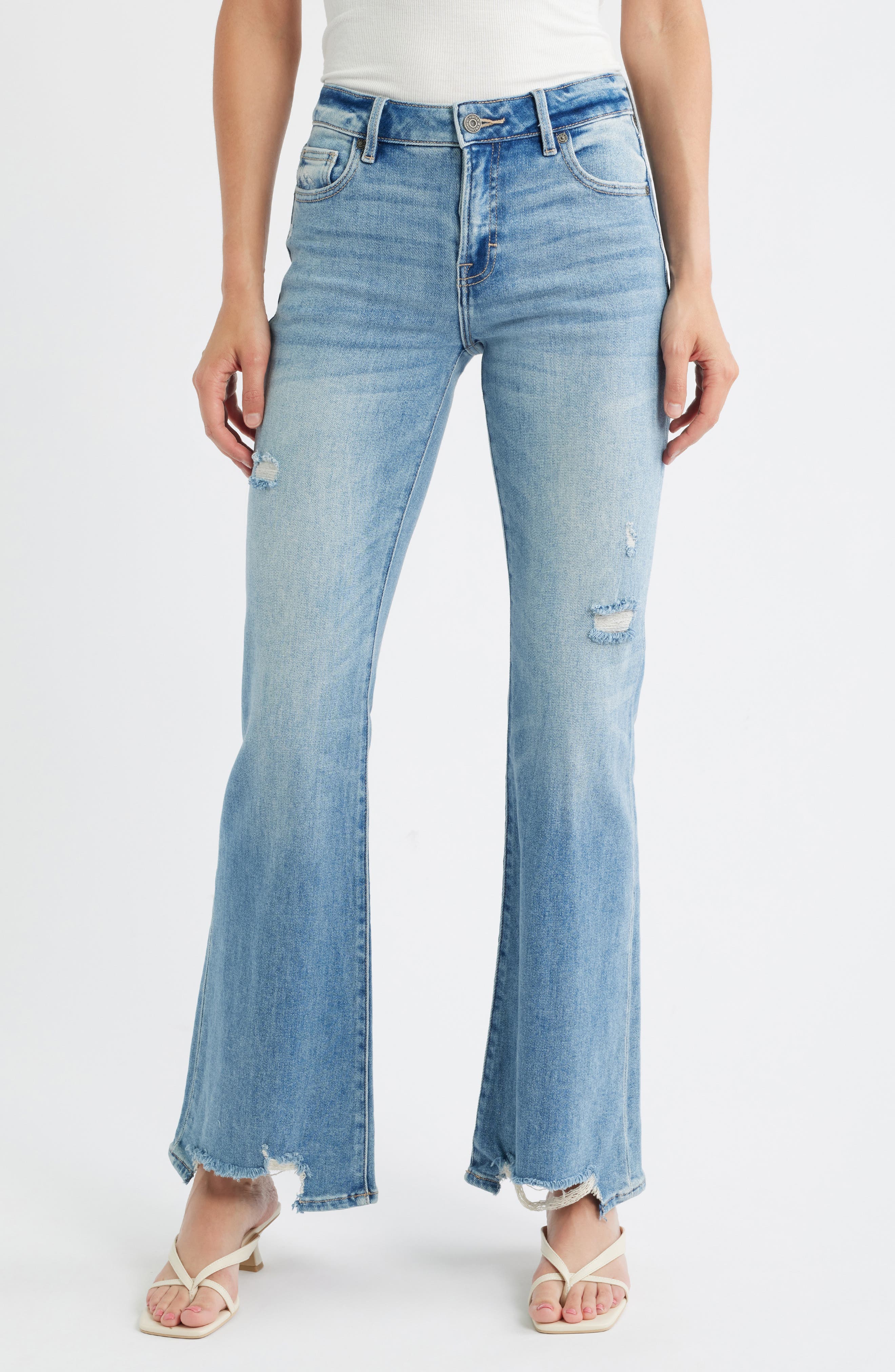 Ripped Mid Rise Step Hem Flare Jeans